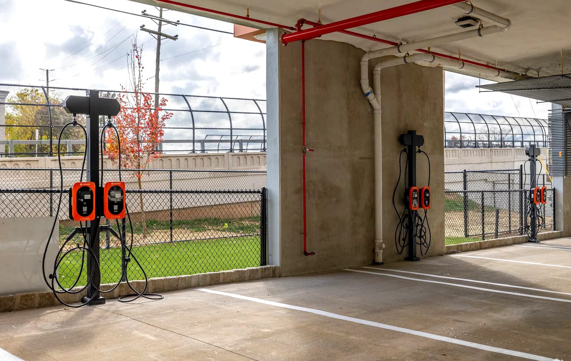 Electric vehicle charging stations in the parking area