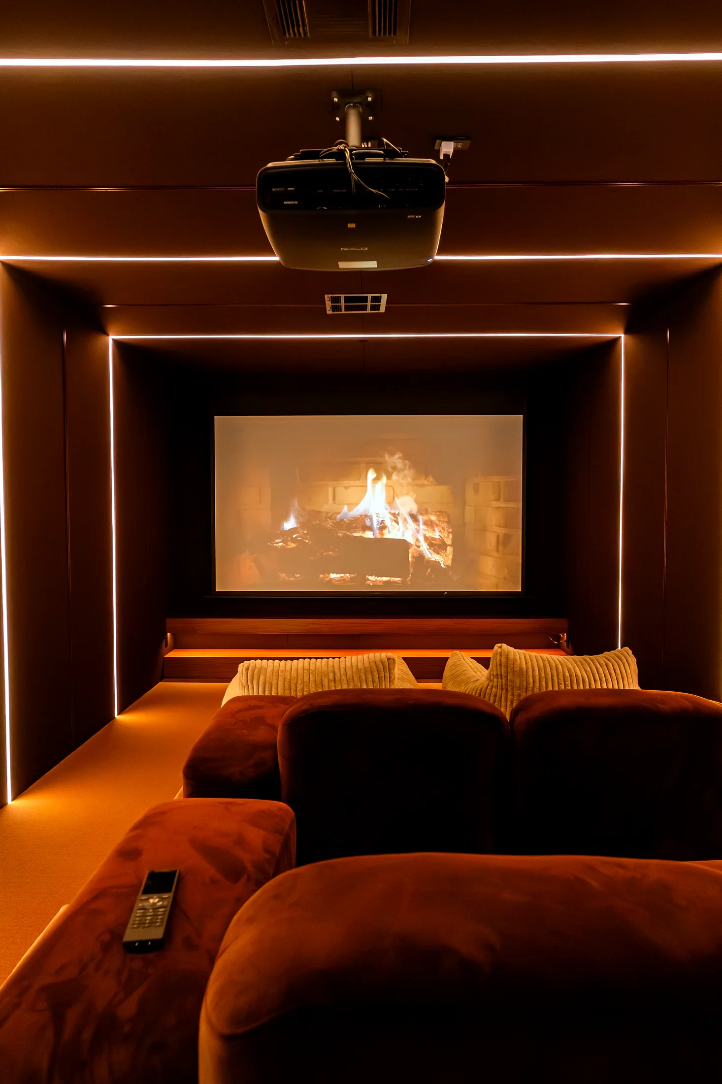 Theater room at Five85West with velvet seating and lines of light
